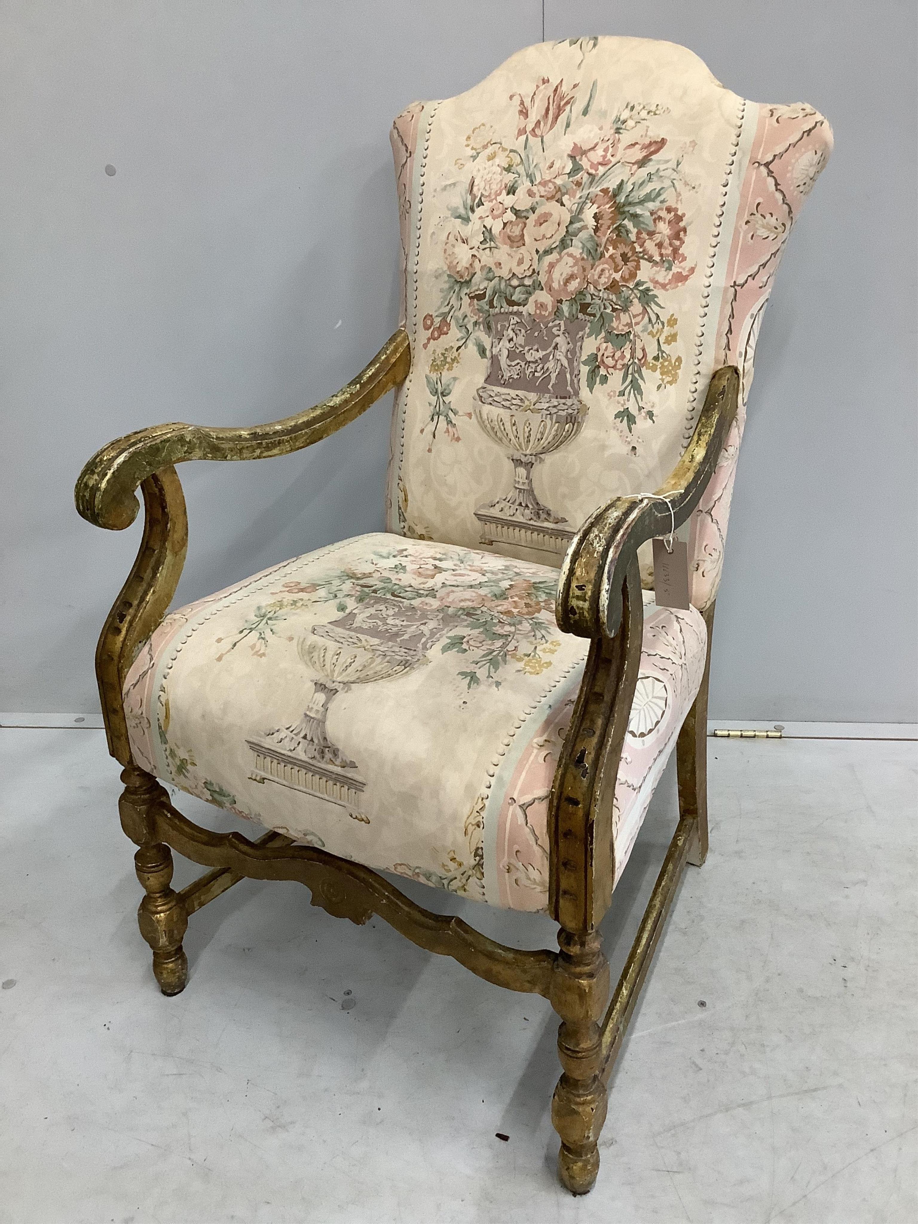 A French giltwood and tapestry open armchair, width 58cm, depth 56cm, height 102cm. Condition - fair to good